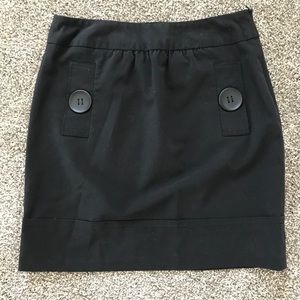 Black thigh length skirt chunky buttons pockets
